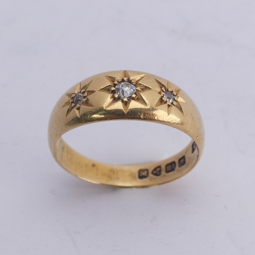 290 - An 18ct yellow gold Band, gypsy set with three graduated diamond points, Size M, 4g.... 