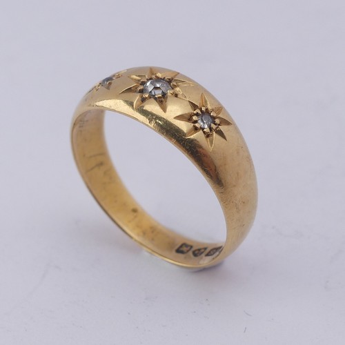 290 - An 18ct yellow gold Band, gypsy set with three graduated diamond points, Size M, 4g.... 