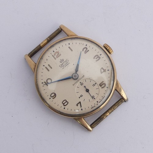 215 - Railwayana; A 9ct gold Smiths De Luxe Wristwatch, champagne dial with Arabic Numerals, subsidiary se... 