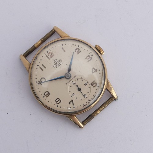 215 - Railwayana; A 9ct gold Smiths De Luxe Wristwatch, champagne dial with Arabic Numerals, subsidiary se... 