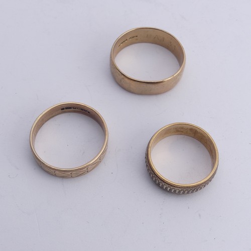 291 - A 9ct two colour gold Band, with geometric decoration, 6.9mm wide, Size P, together with a 9ct gold ... 