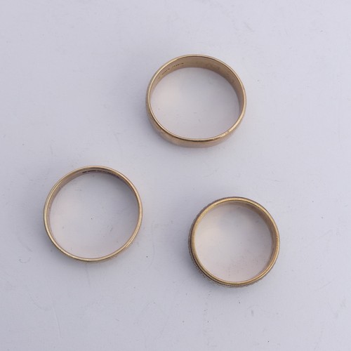 291 - A 9ct two colour gold Band, with geometric decoration, 6.9mm wide, Size P, together with a 9ct gold ... 