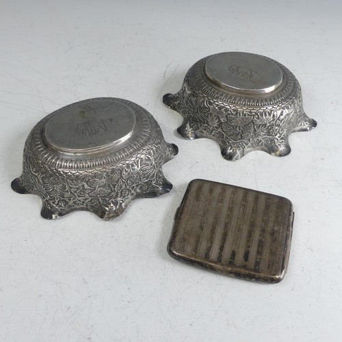 73 - A pair of Indian silver Bowls, of oval form with wavy rims, with typical continuous scene decoration... 