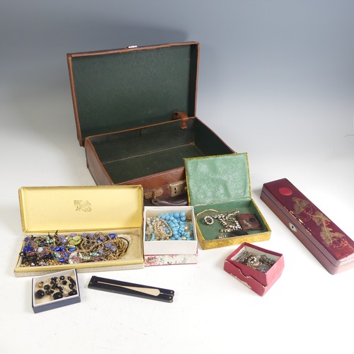 373 - A vintage leather case containing a quantity of Costume Jewellery, including a garnet cluster pendan... 