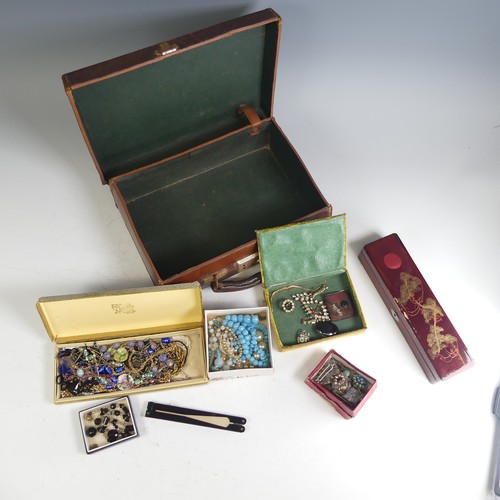 373 - A vintage leather case containing a quantity of Costume Jewellery, including a garnet cluster pendan... 