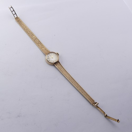 216 - A 9ct yellow gold lady's Tissot Wristwatch, 12mm diameter, on an integral 9ct gold mesh bracelet str... 