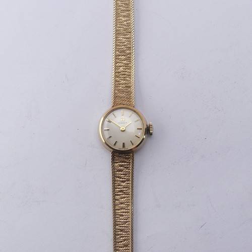 216 - A 9ct yellow gold lady's Tissot Wristwatch, 12mm diameter, on an integral 9ct gold mesh bracelet str... 