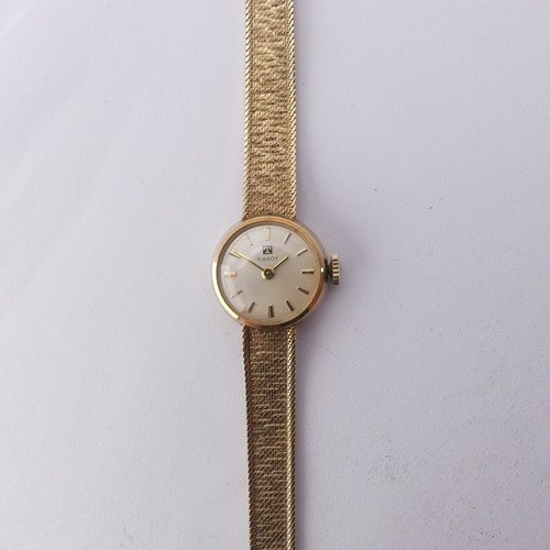 216 - A 9ct yellow gold lady's Tissot Wristwatch, 12mm diameter, on an integral 9ct gold mesh bracelet str... 