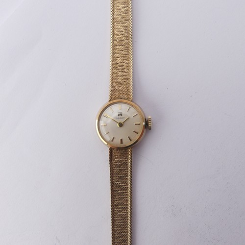 216 - A 9ct yellow gold lady's Tissot Wristwatch, 12mm diameter, on an integral 9ct gold mesh bracelet str... 