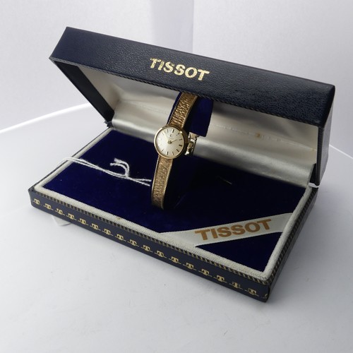 216 - A 9ct yellow gold lady's Tissot Wristwatch, 12mm diameter, on an integral 9ct gold mesh bracelet str... 