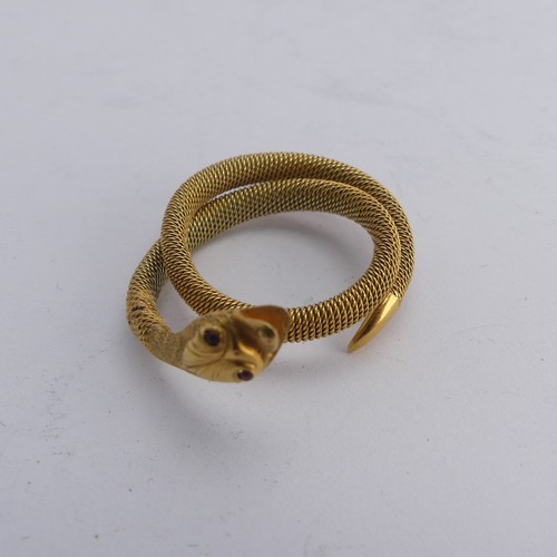 248 - A 9ct gold mesh Ring, forming a coiled snake, with ruby glass eyes, 3.6g.