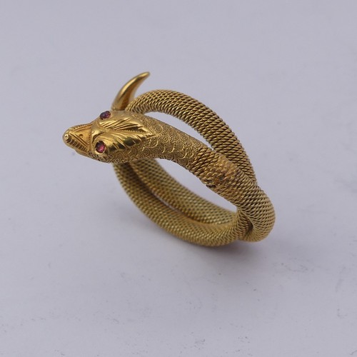 248 - A 9ct gold mesh Ring, forming a coiled snake, with ruby glass eyes, 3.6g.