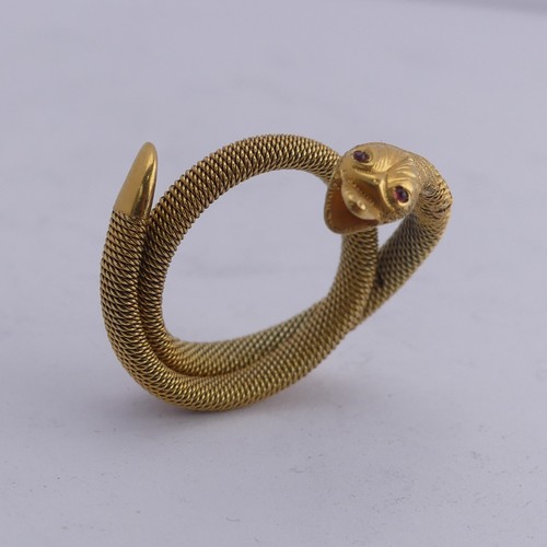 248 - A 9ct gold mesh Ring, forming a coiled snake, with ruby glass eyes, 3.6g.