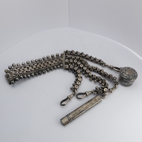 76 - A Victorian silver Chatelaine, in the Aesthetic movement style, with four chains all with clip ends,... 