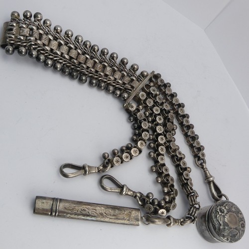 76 - A Victorian silver Chatelaine, in the Aesthetic movement style, with four chains all with clip ends,... 