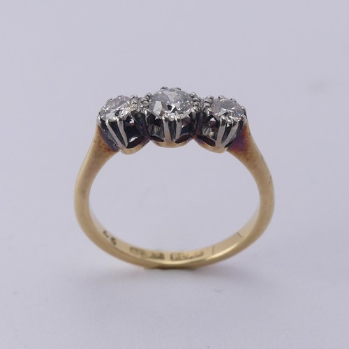 250 - A three stone diamond Ring, the centre stone approx. 0.21ct, with a smaller stone on either side, ap... 