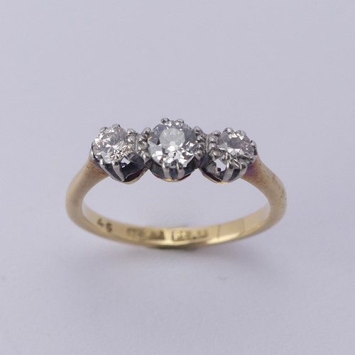 250 - A three stone diamond Ring, the centre stone approx. 0.21ct, with a smaller stone on either side, ap... 