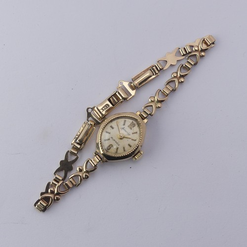 224 - A 9ct gold lady's Wristwatch, on 9ct bracelet strap, gross total weight 9.1g.