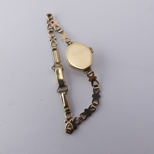 224 - A 9ct gold lady's Wristwatch, on 9ct bracelet strap, gross total weight 9.1g.