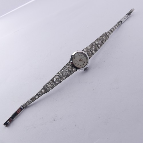 225 - A 9ct white gold and diamond Cocktail Watch, the silvered dial signed Verity, with a Swiss 17-jewels... 