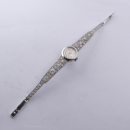 225 - A 9ct white gold and diamond Cocktail Watch, the silvered dial signed Verity, with a Swiss 17-jewels... 