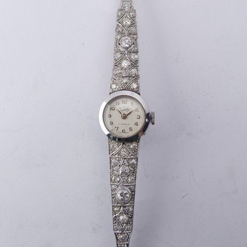 225 - A 9ct white gold and diamond Cocktail Watch, the silvered dial signed Verity, with a Swiss 17-jewels... 