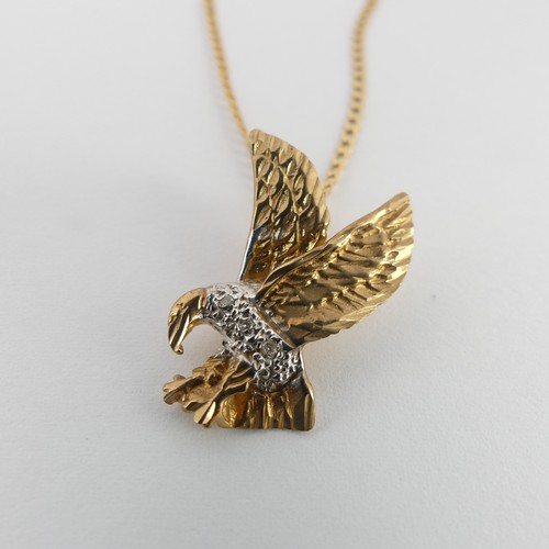 302 - A 9ct yellow and white gold Eagle Pendant, the body set with diamond points, 2.3cm long, on a 9ct go... 