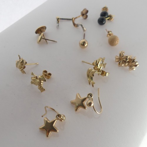 389 - A quantity of small 9ct gold Ear Studs, together with two 9ct gold St. Christopher pendants, a small... 