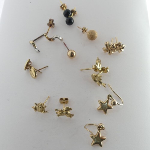 389 - A quantity of small 9ct gold Ear Studs, together with two 9ct gold St. Christopher pendants, a small... 