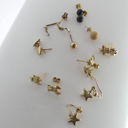 389 - A quantity of small 9ct gold Ear Studs, together with two 9ct gold St. Christopher pendants, a small... 