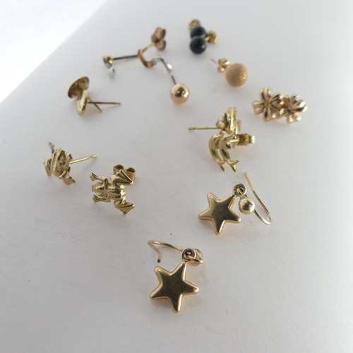 389 - A quantity of small 9ct gold Ear Studs, together with two 9ct gold St. Christopher pendants, a small... 