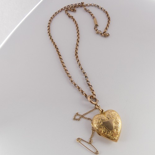 303 - An Edwardian 15ct gold heart shaped Pendant Locket, hallmarked Chester, 1908, the front with foliate... 