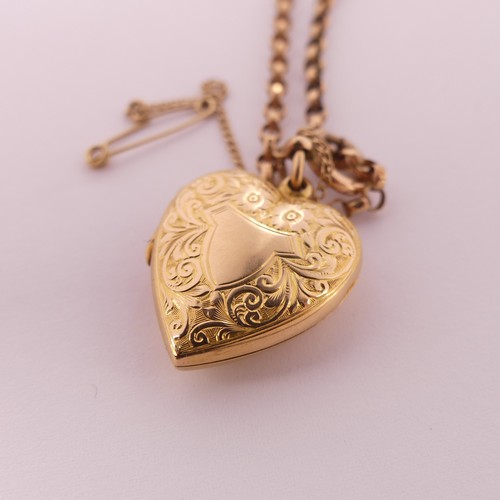 303 - An Edwardian 15ct gold heart shaped Pendant Locket, hallmarked Chester, 1908, the front with foliate... 