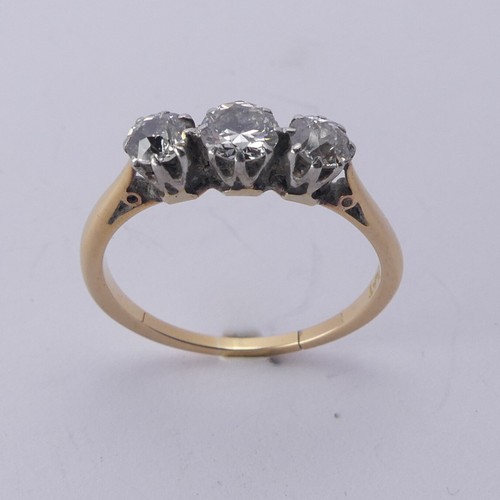 254 - A three stone diamond Ring, the old cut stones claw set in 18ct yellow gold and platinum, approx. to... 