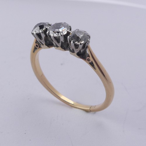 254 - A three stone diamond Ring, the old cut stones claw set in 18ct yellow gold and platinum, approx. to... 