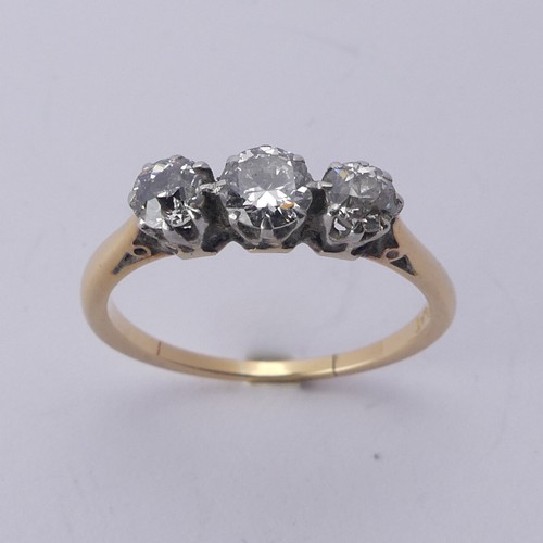 254 - A three stone diamond Ring, the old cut stones claw set in 18ct yellow gold and platinum, approx. to... 