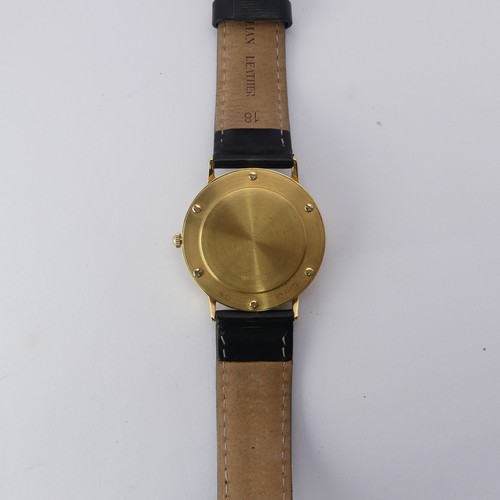 227 - A cased Rotary Elite 18ct gold quartz Wristwatch, 33mm diameter, with guarantee booklet, running, as... 