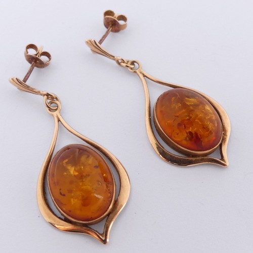 342 - A pair of 9ct gold mounted amber drop Earrings, the cabochon stones 16mm long, overall drop 4.5cm, t... 