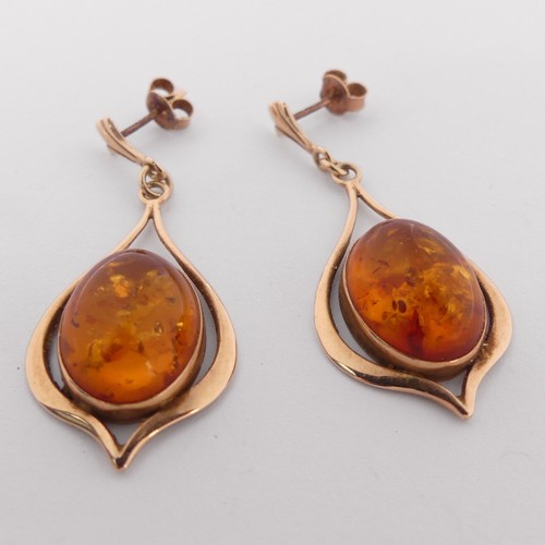 342 - A pair of 9ct gold mounted amber drop Earrings, the cabochon stones 16mm long, overall drop 4.5cm, t... 