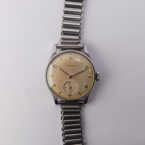 230 - A vintage stainless steel Longines Wristwatch, the signed dial with alternate steel baton and Arabic... 