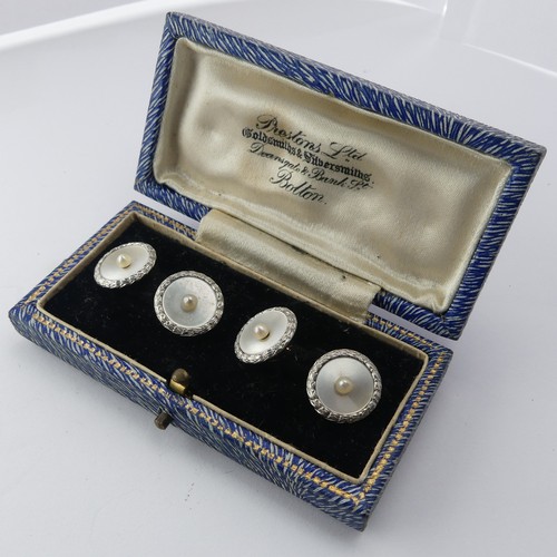 399 - A cased pair of Art Deco mother-of-pearl Cufflinks, with cultured pearl centres and textured platinu... 