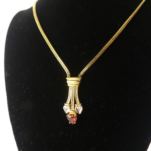 304 - A 9ct yellow gold Pendant, set red and white heart shaped pastes, on integral 9ct gold chain, 42cm l... 