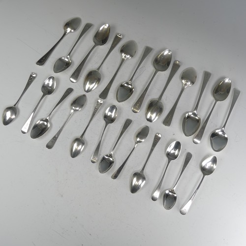 150 - A matched set of twelve George III silver Dessert Spoons, Old English pattern, various dates and mak... 