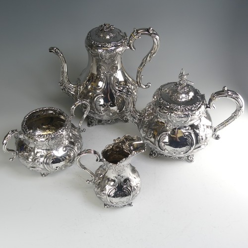 190 - A Victorian silver four piece Tea Set, hallmarked Sheffield, 1865, of baluster form with elaborate f... 