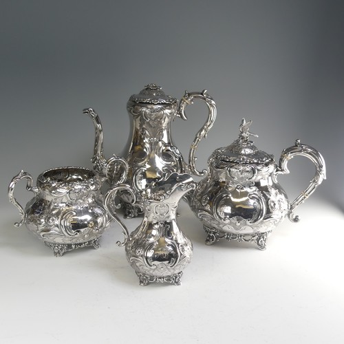 190 - A Victorian silver four piece Tea Set, hallmarked Sheffield, 1865, of baluster form with elaborate f... 