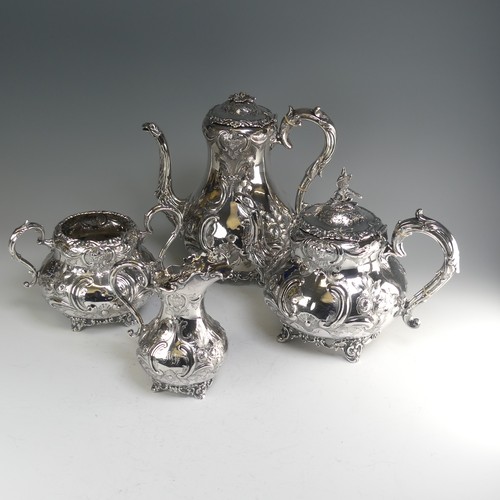 190 - A Victorian silver four piece Tea Set, hallmarked Sheffield, 1865, of baluster form with elaborate f... 