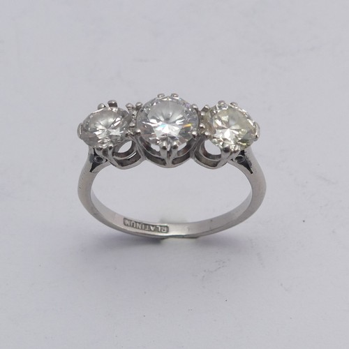 258 - A three stone diamond Ring, the centre stone approx. 0.8ct, with a smaller stone on either side, one... 