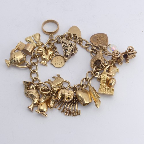 323 - A 9ct yellow gold curb link Bracelet, with 9ct gold padlock clasp, with twenty three charms suspende... 