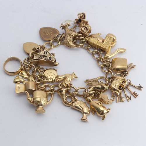 323 - A 9ct yellow gold curb link Bracelet, with 9ct gold padlock clasp, with twenty three charms suspende... 