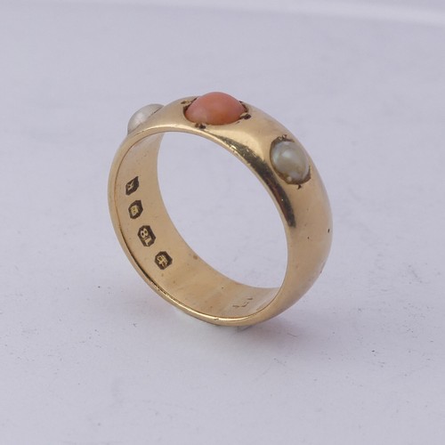 259 - A coral and cultured pearl three stone Ring, the 18ct yellow gold band set with central circular pal... 